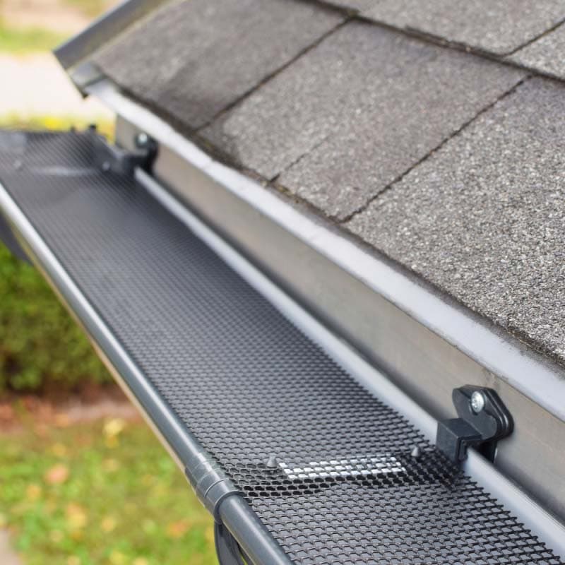 new gutter guards installed to prevent clogging