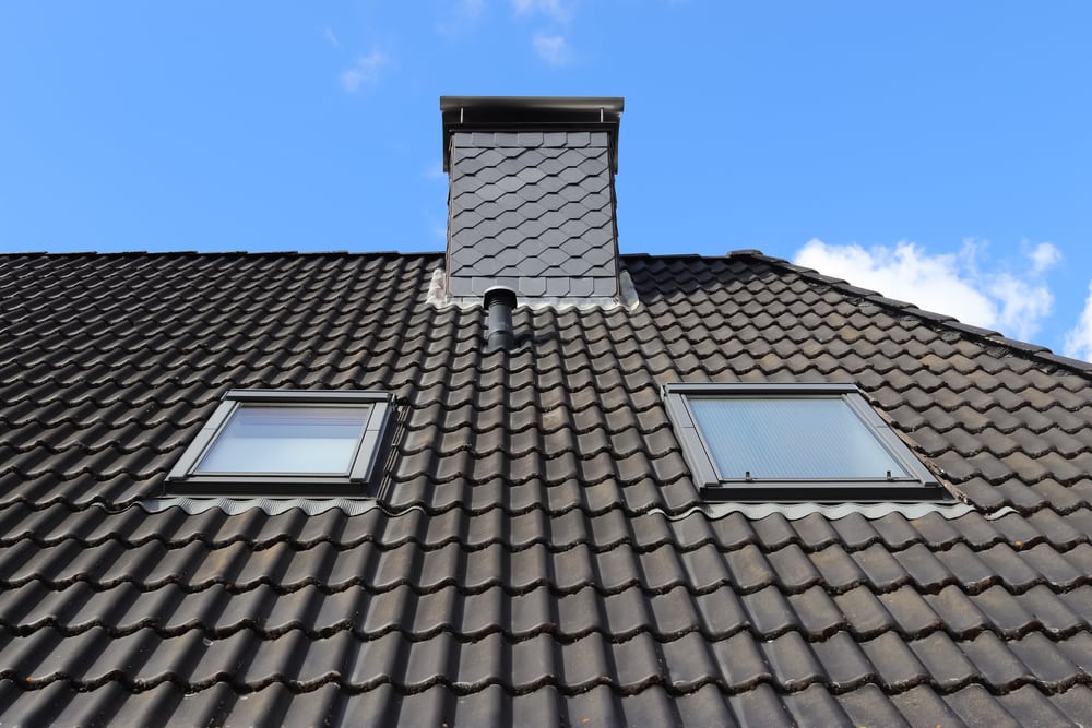 Roof Window In Velux Style With Black Roof Tiles.