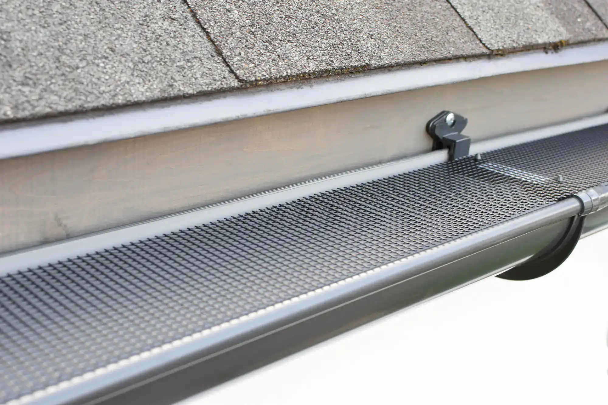 Close-up of high-quality gutter guards installed by SkyLuxe Construction in Suffolk County, NY, designed to protect against debris and improve drainage