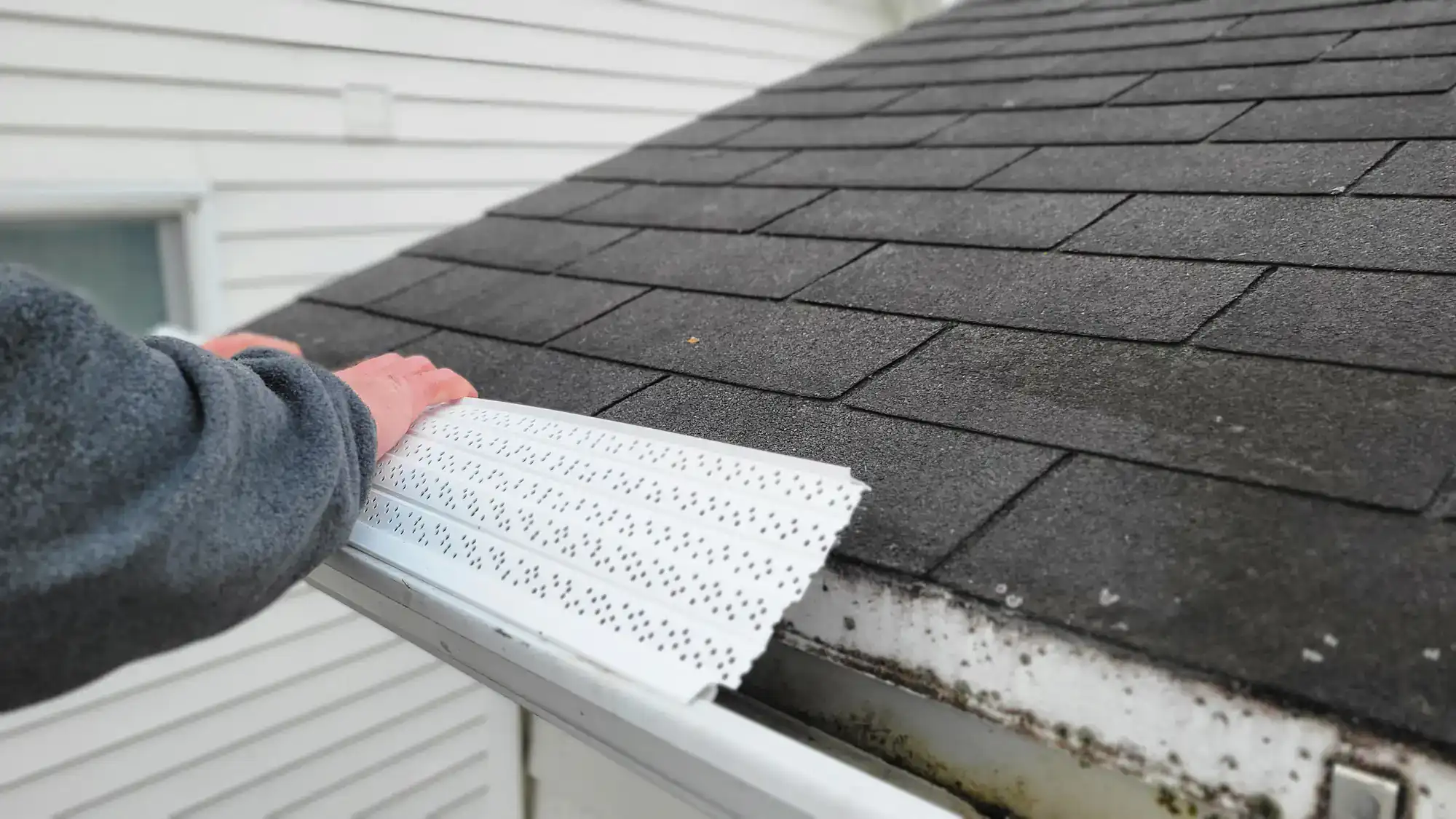 Professional gutter guards installation by SkyLuxe Construction in Suffolk County, NY, protecting your roof from debris and water damage